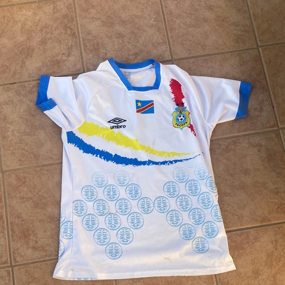 Umbro Kids White and Blue Soccer Jersey with Colorful Accents